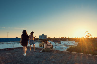 Friends in the rooftop relaxing during summer