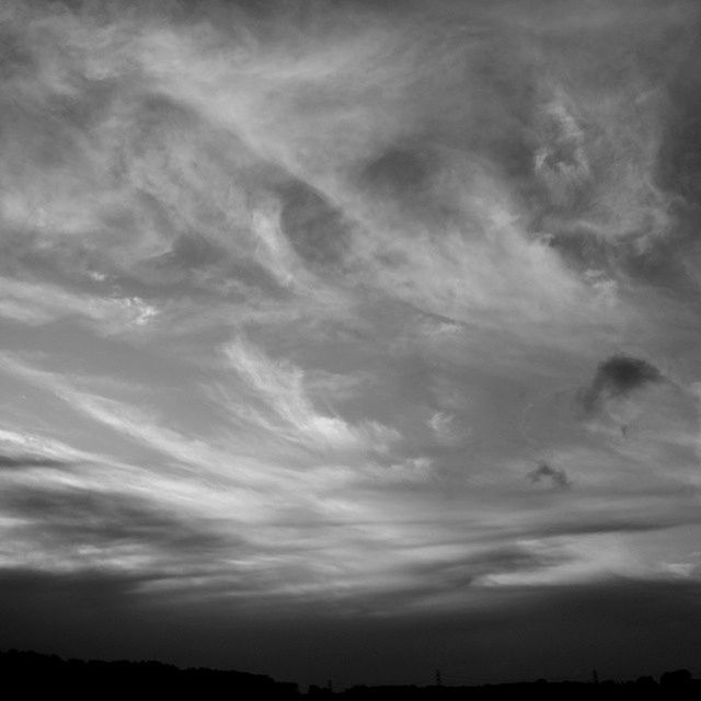 sky, cloud - sky, silhouette, tranquility, tranquil scene, scenics, cloudy, beauty in nature, nature, cloud, low angle view, weather, overcast, dusk, idyllic, sunset, outdoors, cloudscape, landscape, no people