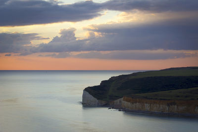 Scenic view of sea against dramatic sky