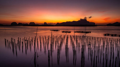 Scenic view of sea against romantic sky at sunset