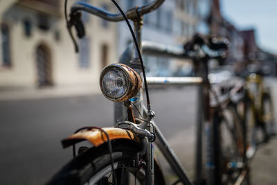 Close-up of bicycle parked on road