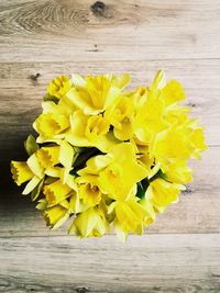 Close-up of yellow flowers on table