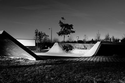 Scenic view of trees on field against sky