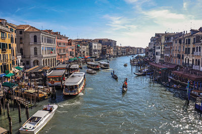 Overview of buildings and gondolas in the canal grande of venice, italy