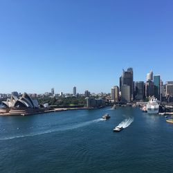 View of buildings in city against blue sky