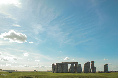 Built structure on field against sky