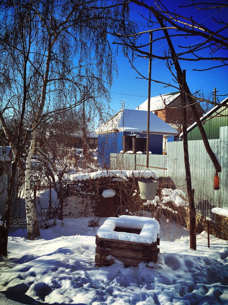 snow, winter, cold temperature, season, building exterior, built structure, architecture, tree, covering, weather, bare tree, house, white color, blue, frozen, covered, nature, field, residential structure, sunlight