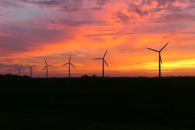 Wind turbine silhouettes at sunset