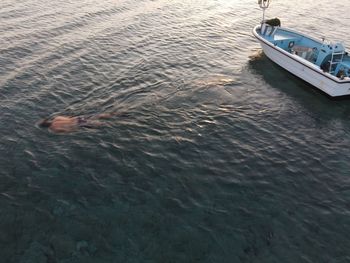 High angle view of boat sailing in sea