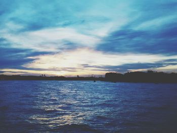 Scenic view of sea against cloudy sky