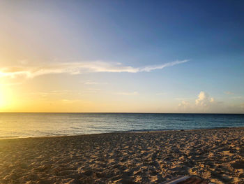 Scenic view of sea against colored sky during evening sunset