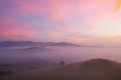 Scenic view of mountains against sky during sunset