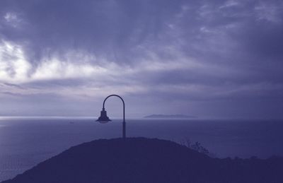 Scenic view of sea against sky at dusk