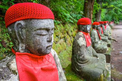 Close-up of statues on land