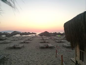 Scenic view of beach against sky during sunset