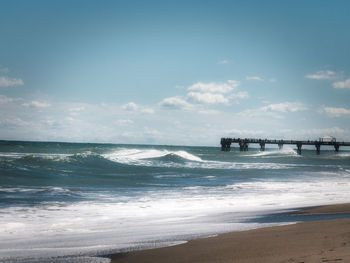 Scenic view of beach against sky