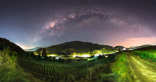 Scenic view of field against sky at night