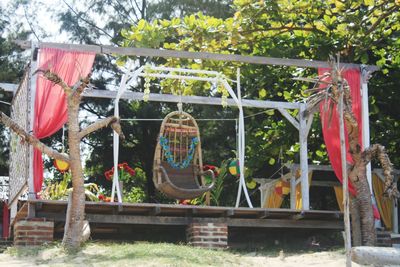 View of swing hanging in park