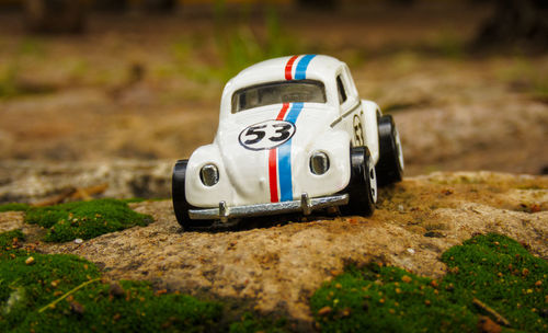 Close-up of toy car on field