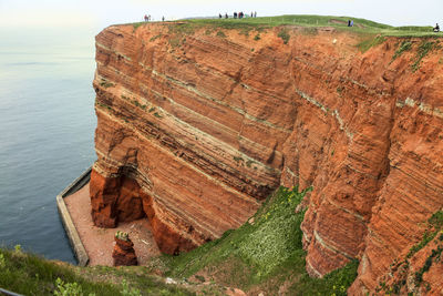 High angle view of rock formation and sea