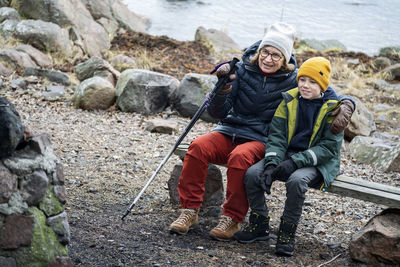 Grandmother sitting with grandson o bench