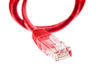 Close-up of computer cable over white background