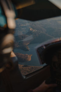 Close-up of man seen through window