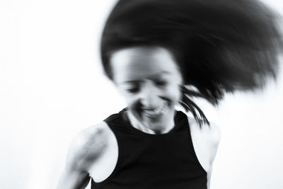 Portrait of young man against white background