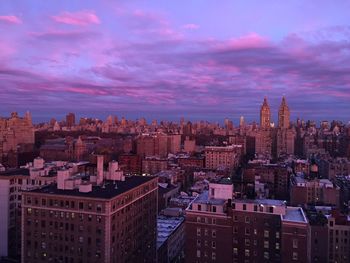 Cityscape against cloudy sky