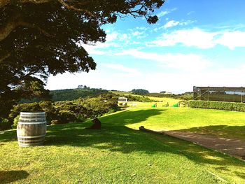 Scenic view of green landscape against sky