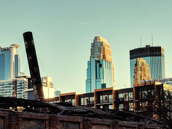 Low angle view of skyscrapers against clear sky