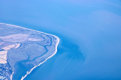 Aerial view of sea against sky during winter