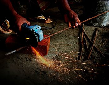 Man working on metal structure in factory