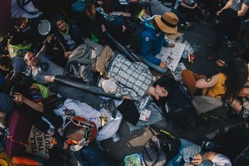 HIGH ANGLE VIEW OF PEOPLE SITTING ON FLOOR