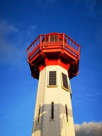 Low angle view of red tower against sky