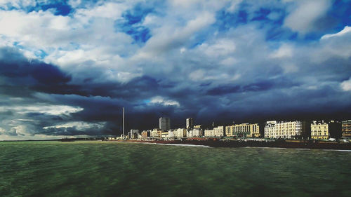 Scenic view of buildings in city against sky