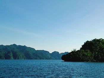 Scenic view of sea against clear blue sky