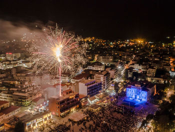 High angle view of illuminated buildings in city at night