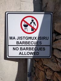 Close-up of warning sign on wall