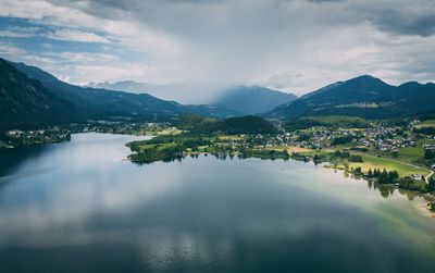 Scenic view of lake and mountains against sky