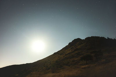 Mountain against clear sky at night