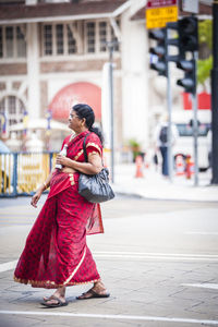 Woman standing on city street