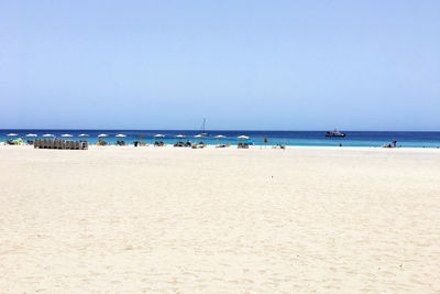 Scenic view of beach against clear sky