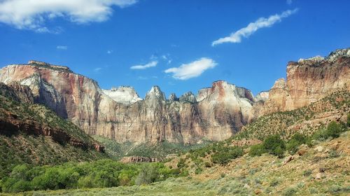 Scenic view of mountains against cloudy sky