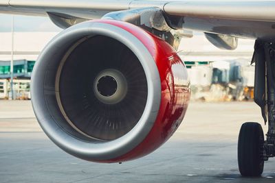 Close-up of airplane at airport runway