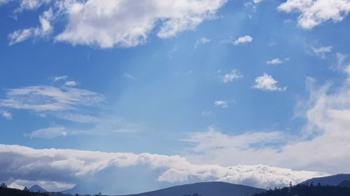 Low angle view of clouds against blue sky