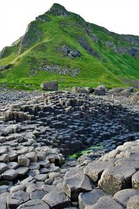 Stone wall with rocks in background