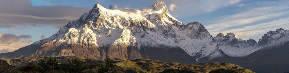 Panoramic view of snowcapped mountains against sky