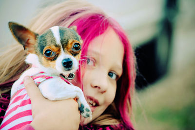 Portrait of cute girl with dog