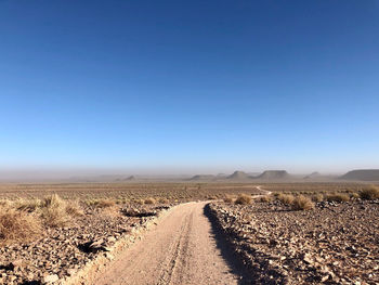 Scenic view of road against clear sky